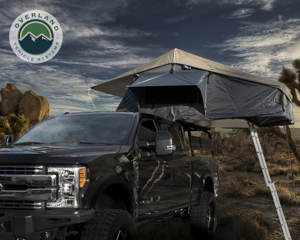 Overland Vehicle Systems Roof Top Tent 4 Person Extended Roof Top Tent Dark Gray Base With Green Rain Fly With Bonus Pack Nomadic Overland Vehicle Systems Roof Top Tent 4 Person Extended Roof Top Tent Dark Gray Base With Green Rain Fly With Bonus Pack Nomadic