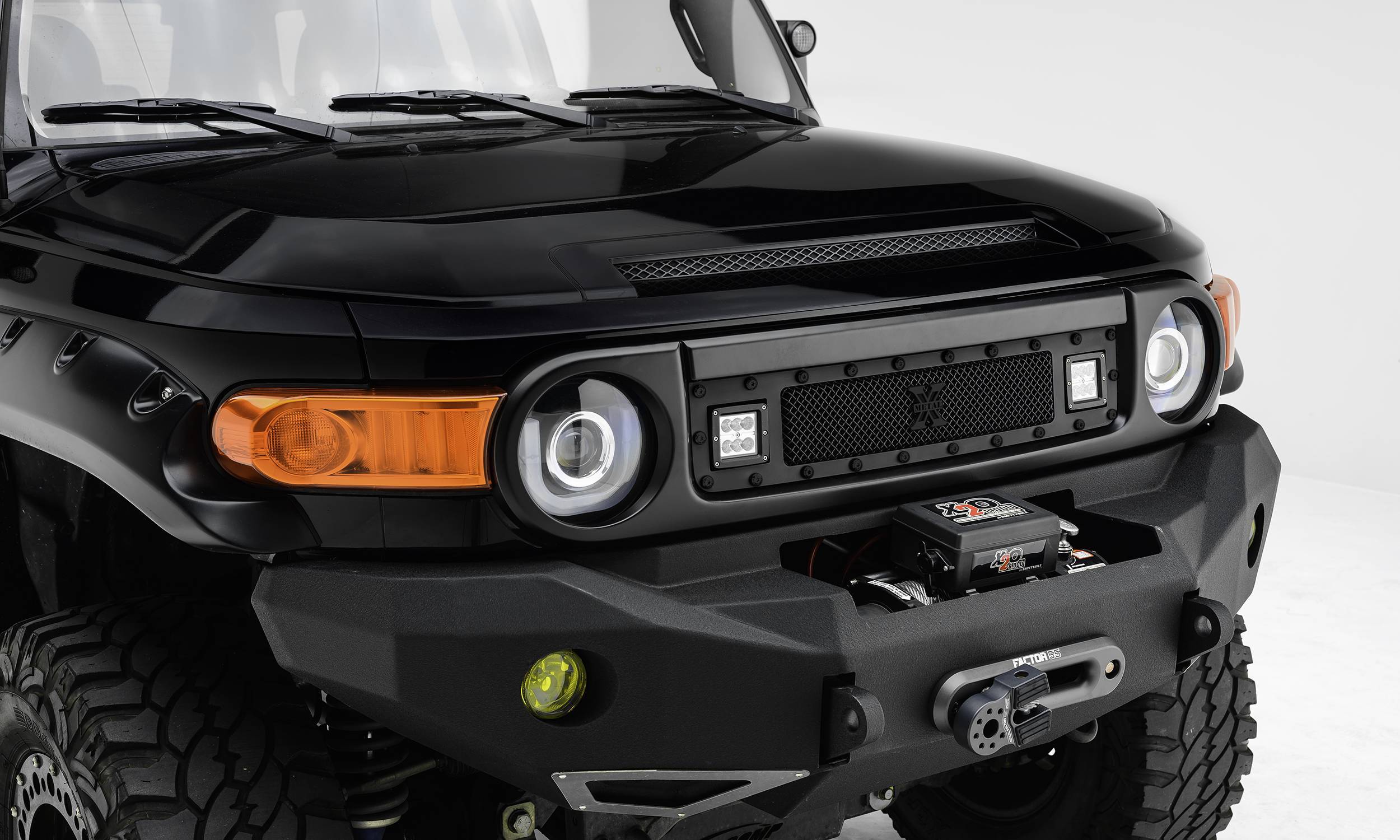 T-Rex 2007-2014 Toyota FJ Cruiser Stealth Torch Grille, Black, 1 Pc, Insert, Black Studs with (2) 3" LED Cube Lights